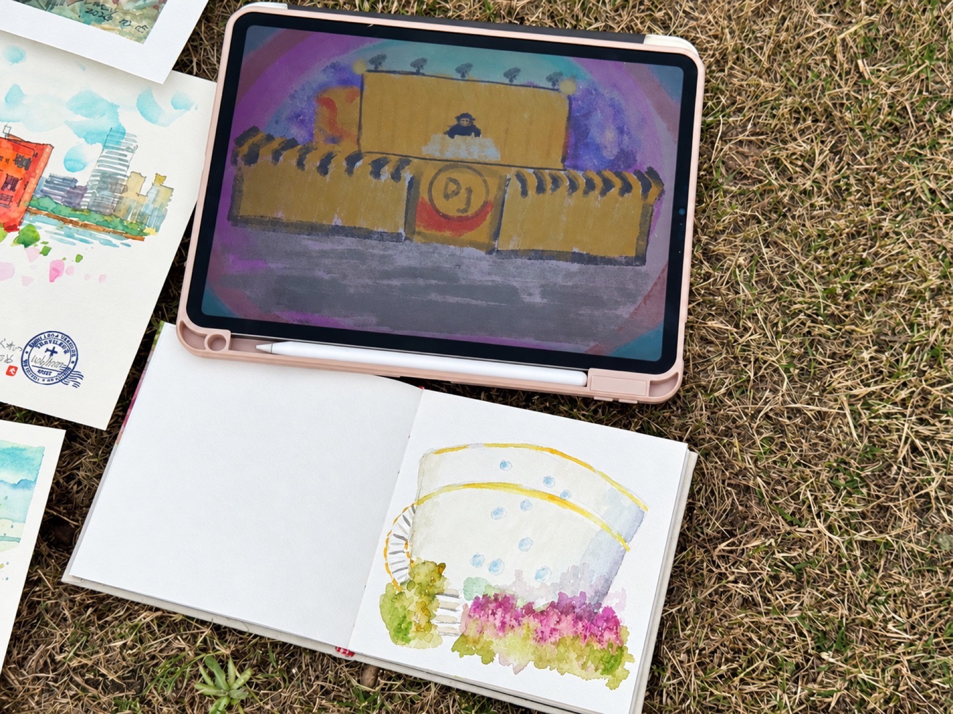 On-location exchange: sketchbooks, paper drawings and a tablet artwork